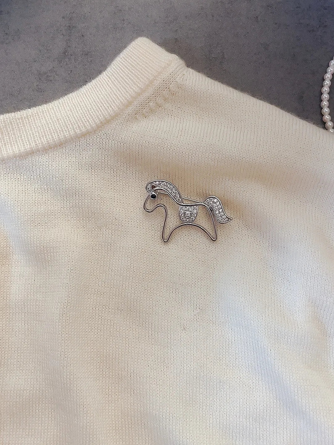 Golden pony brooch packaging